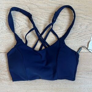 NEW WITH TAGS Navy athletic top with cute criss cross detail, bra cups, lined XS